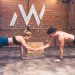 Fit couple working out together in a modern gym, showcasing teamwork and a healthy lifestyle.
